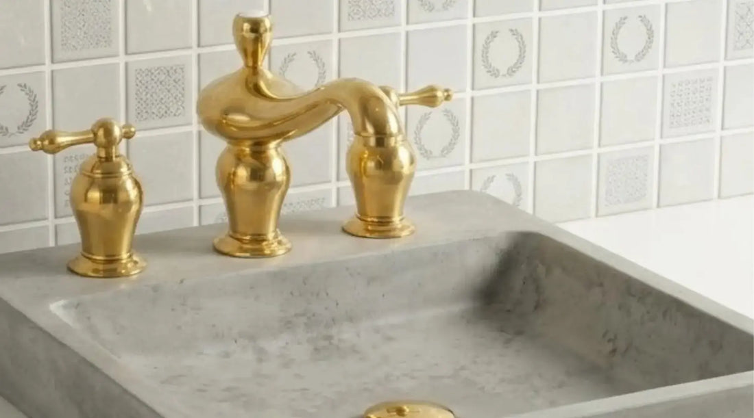 unlacquered brass widespread bathroom faucet installed on marble vanity sink
