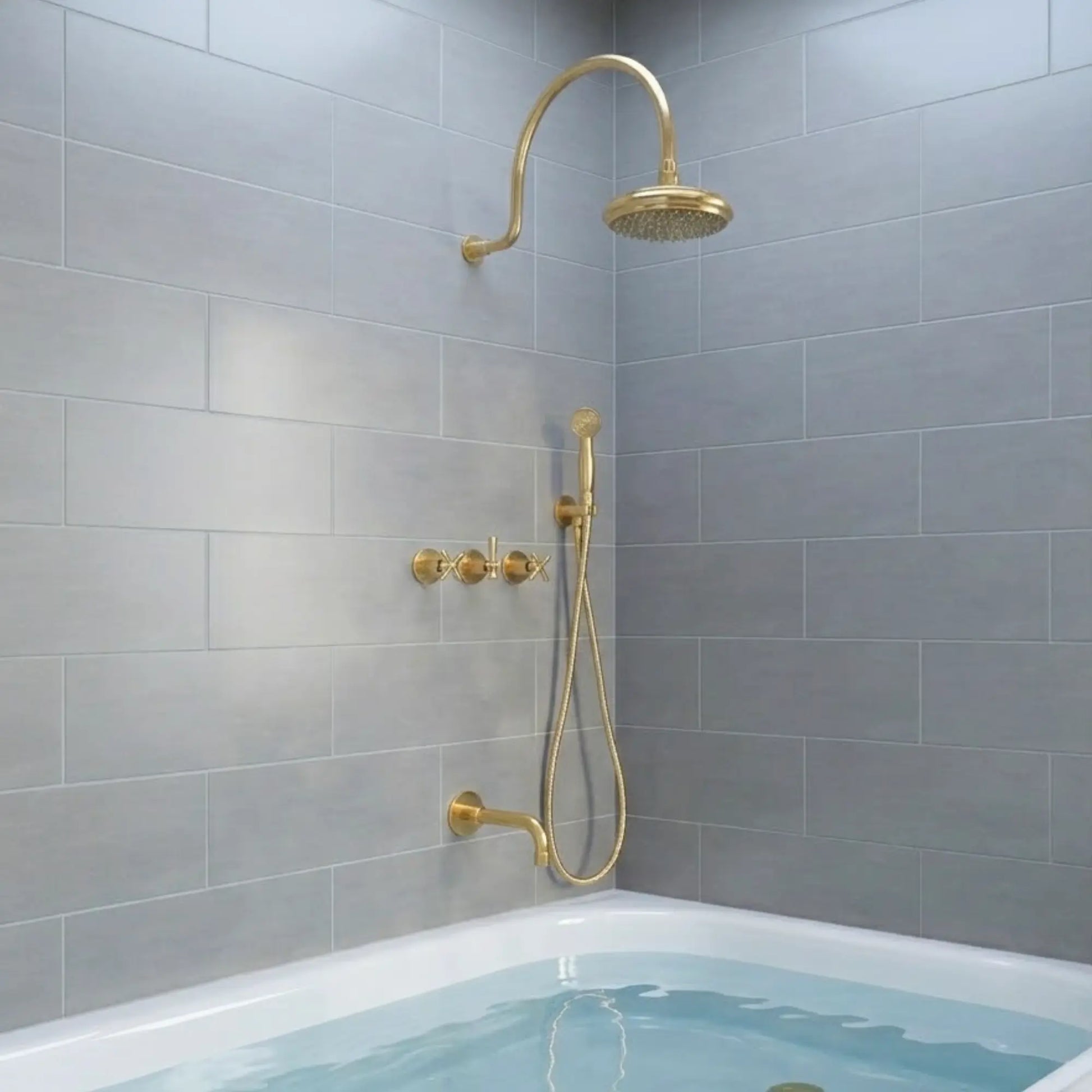 BrassOna® Aurelia unlacquered brass rainfall shower system with handheld sprayer, tub spout and cross handles — full set installed in modern gray tiled bathroom