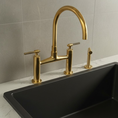 Unlacquered brass kitchen faucet with matching side sprayer and bridge design