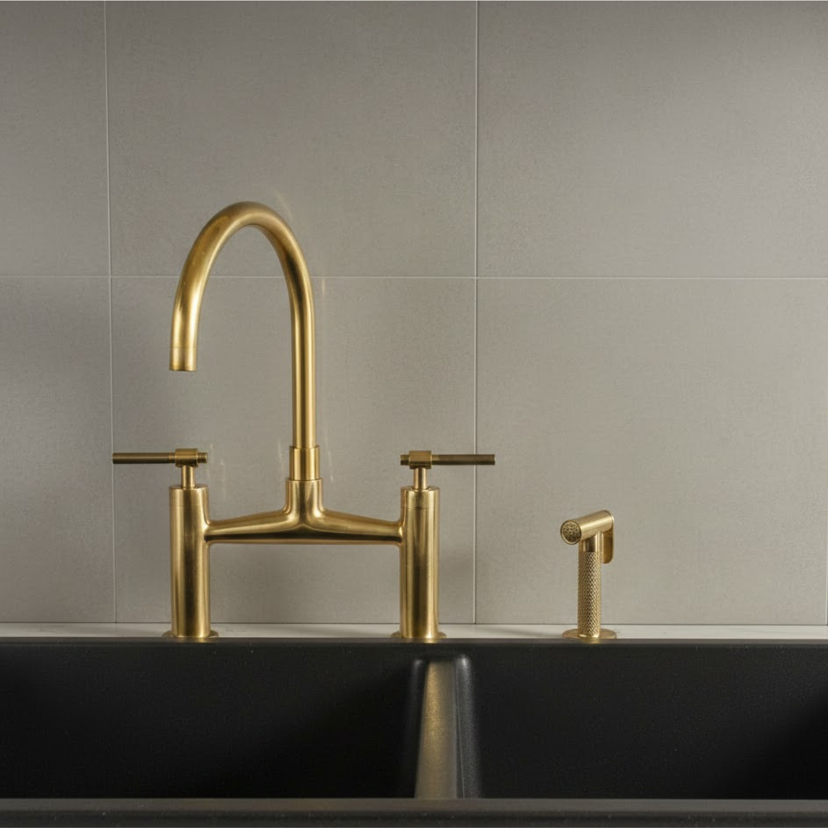 Farmhouse kitchen featuring unlacquered brass bridge faucet with gold tone finish