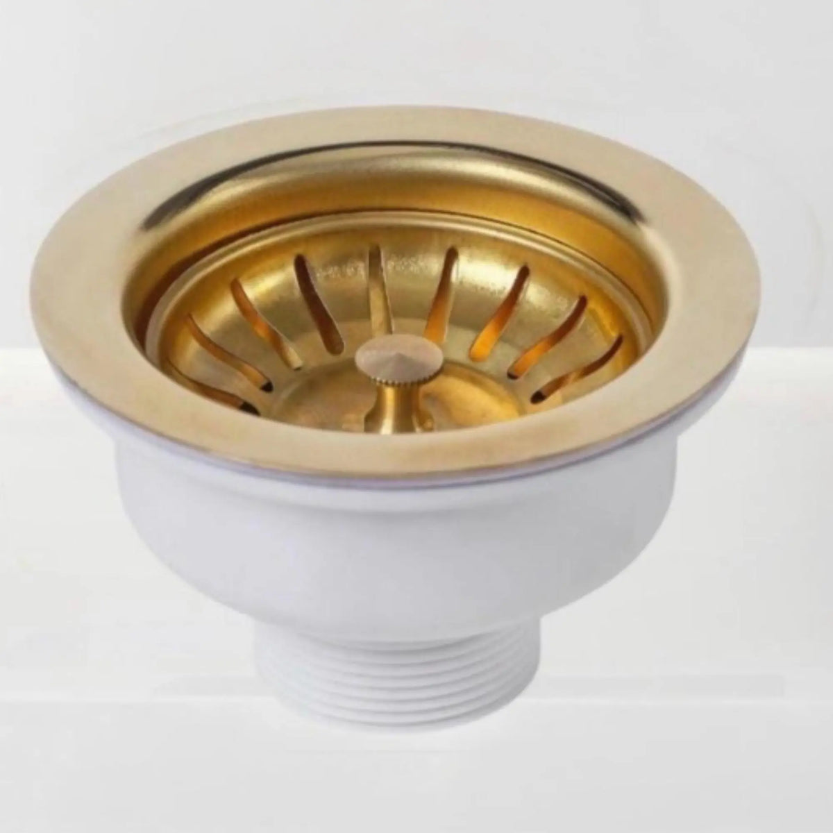 White sink drain with gold interior on a white background