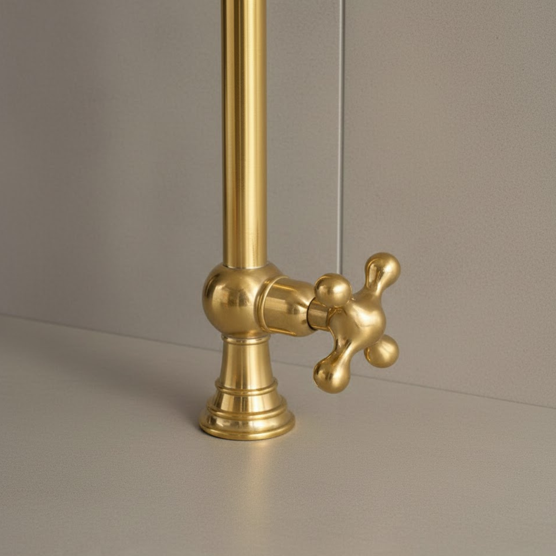 Unlacquered brass pot filler faucet close-up handle detail