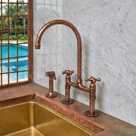 Copper kitchen faucet and sink with a pool view outside