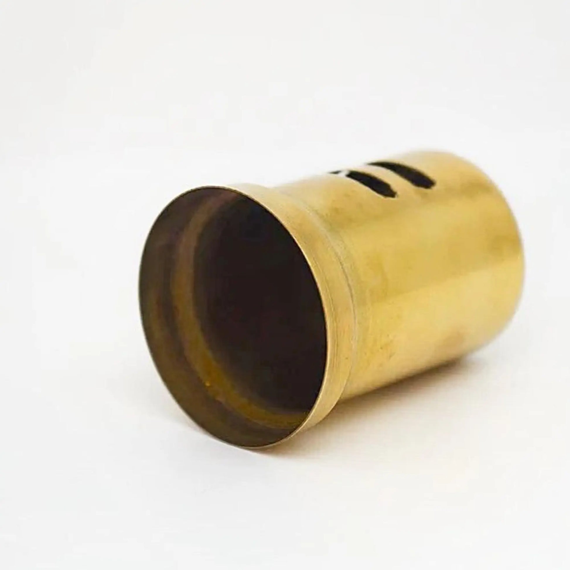 Unlacquered brass sink flange in a white background