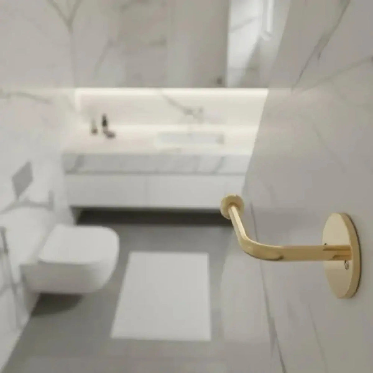Luxury marble bathroom with wall-mounted unlacquered brass toilet paper holder, solid brass bathroom accessory with natural living patina