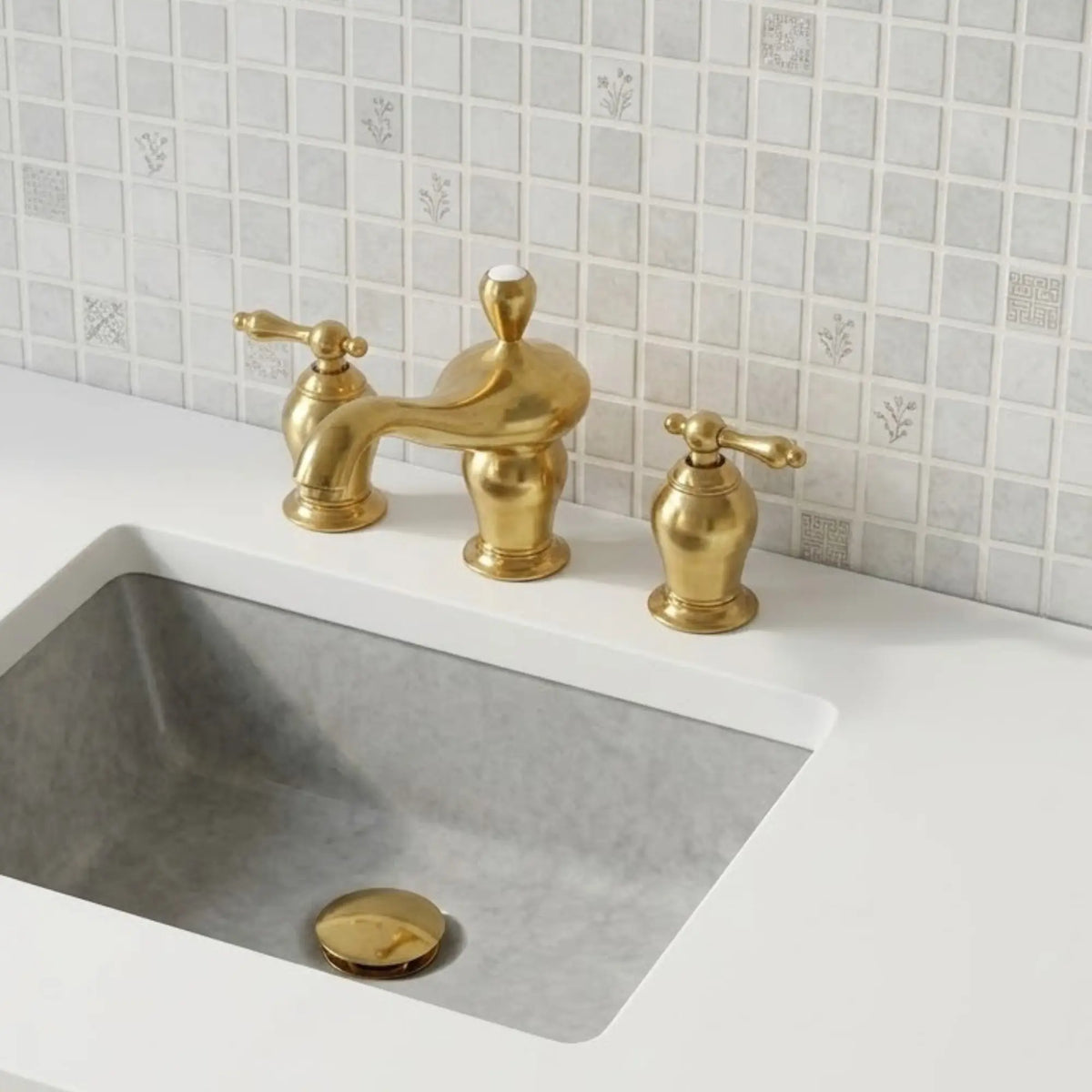 Aurelia unlacquered brass widespread bathroom faucet with lever handles installed on marble sink vanity with tiled backsplash