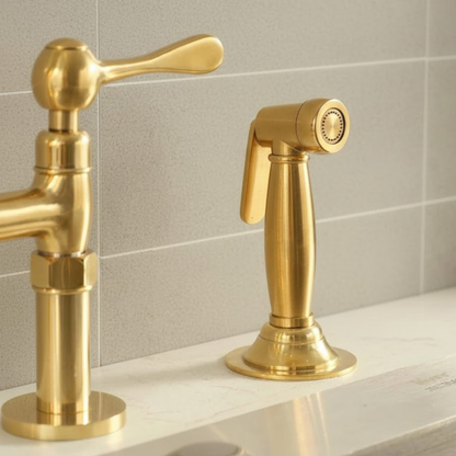 Detailed shot of the matching unlacquered brass side sprayer and handle, highlighting the luxury finish and vintage design