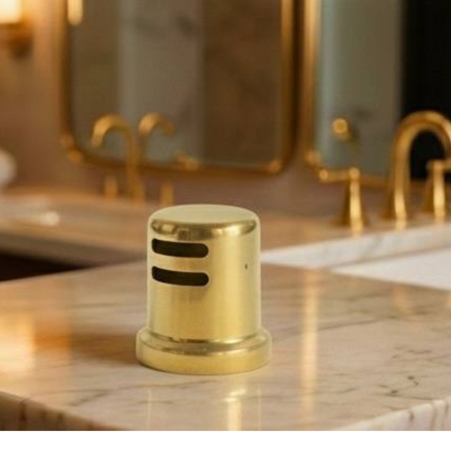 Unlacquered brass sink flange installed in a luxury white farmhouse sink.