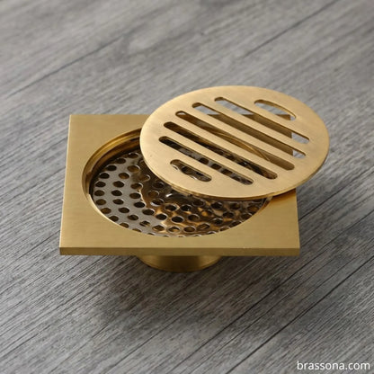BrassOna unlacquered brass anti-odor floor drain with strainer lid
