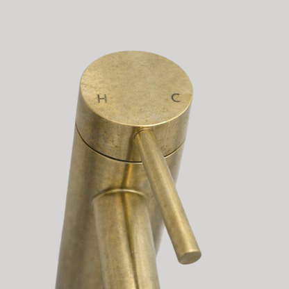 Top view of Castello unlacquered solid brass single-lever faucet showing hot and cold control markings.