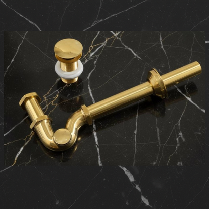Exposed brass bathroom sink P-trap with U-bend design in unlacquered solid brass for luxury interiors