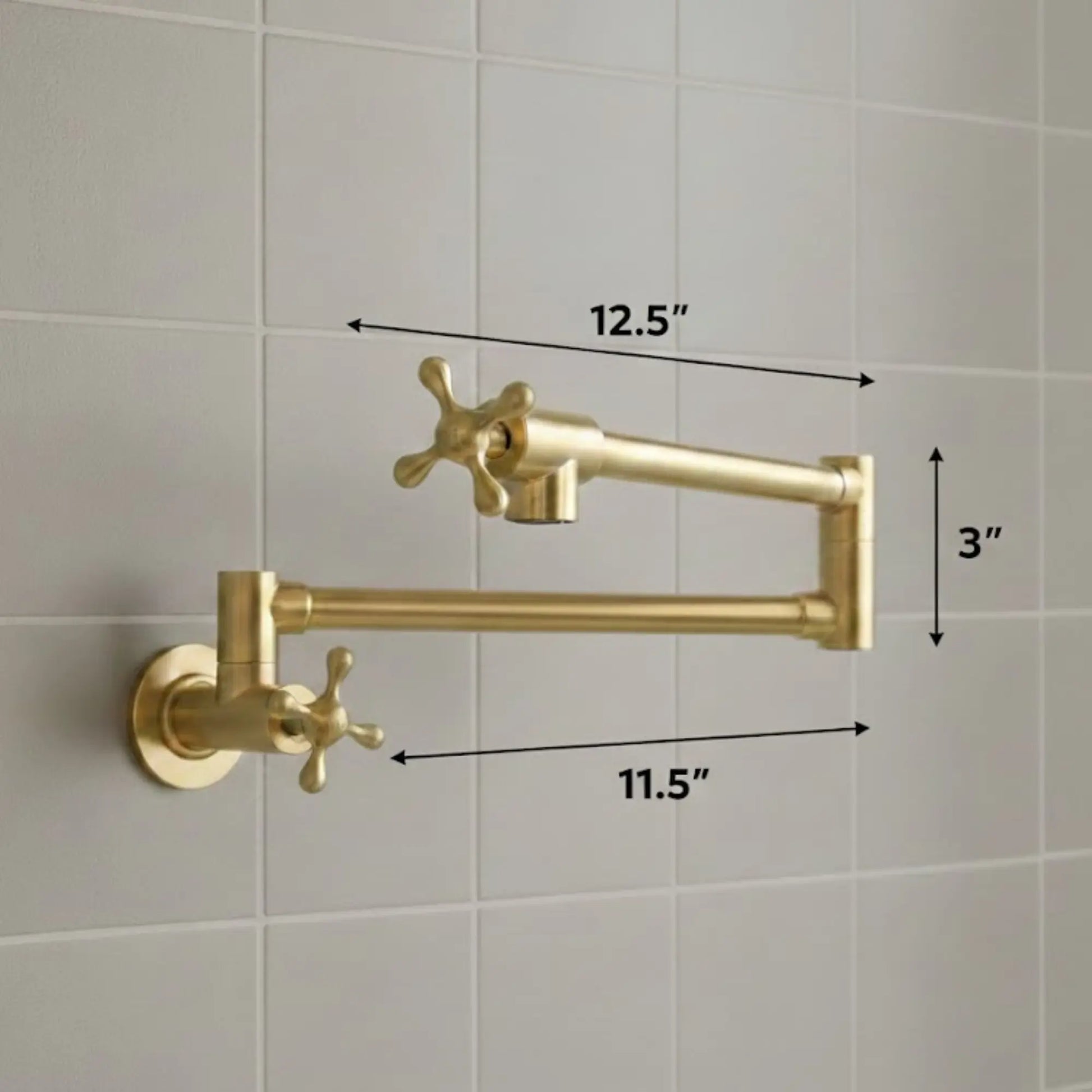 Gold kitchen faucet with dimensions labeled on a tiled wall background