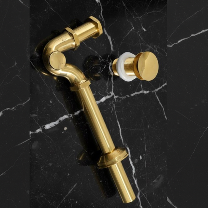 Unlacquered brass P-trap kit with optional matching pop-up drain for coordinated bathroom sink installation