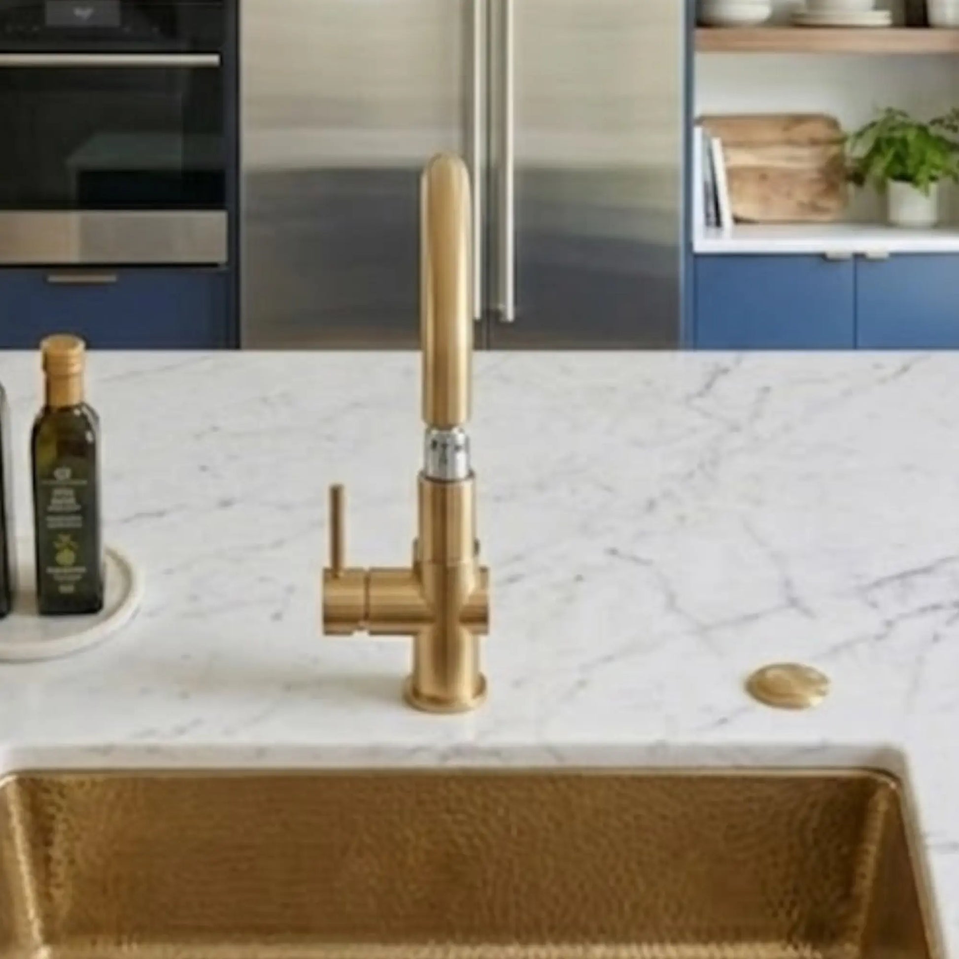 Unlacquered brass kitchen faucet with single lever handle over hammered brass sink