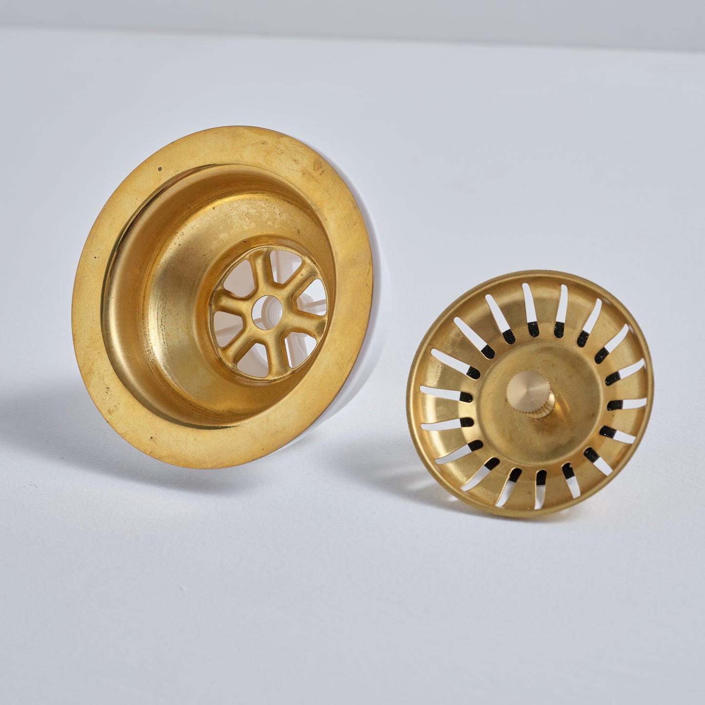 Overhead view of the star-patterned unlacquered brass strainer basket with a living finish