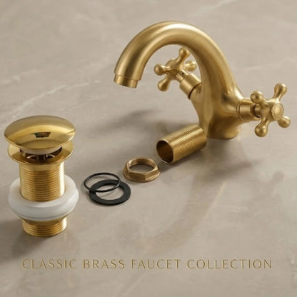 Unlacquered solid brass bathroom sink faucet with cross handles and matching brass pop-up drain set